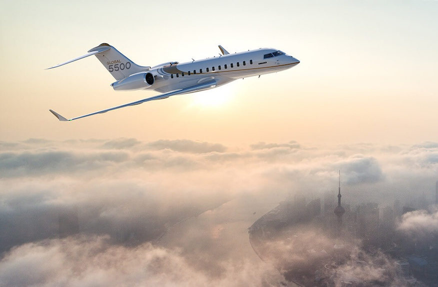 plane-flying-above-clouds-and-a-city-with-sun-rising-in-the-background